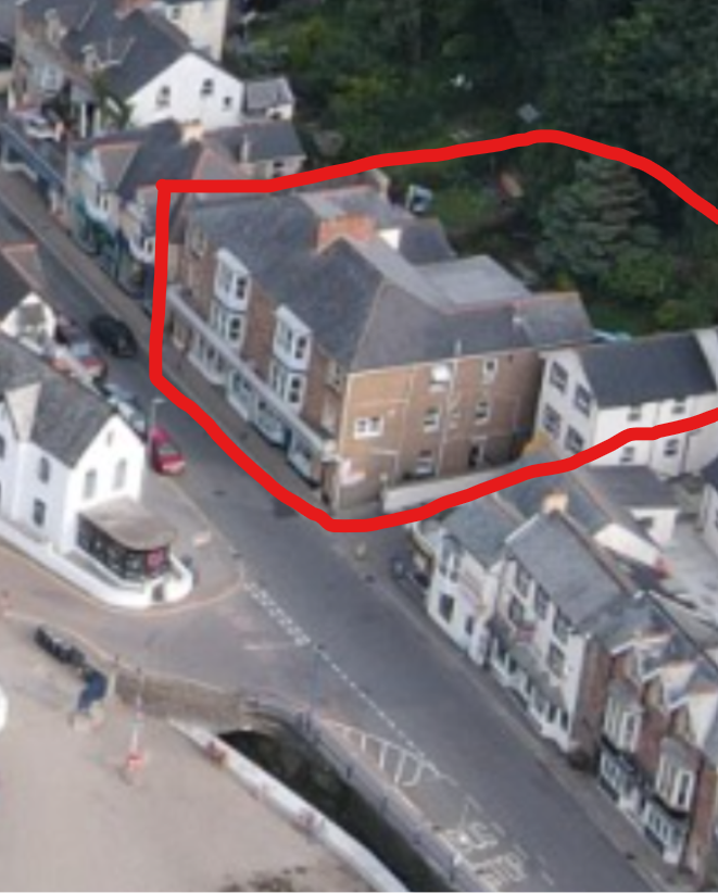 Aerial photograph of Seaside Apartments with the site boundary outlined, showing scope to the rear