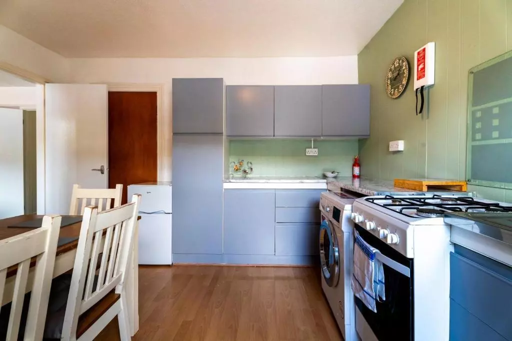 Fitted kitchen with dining area
